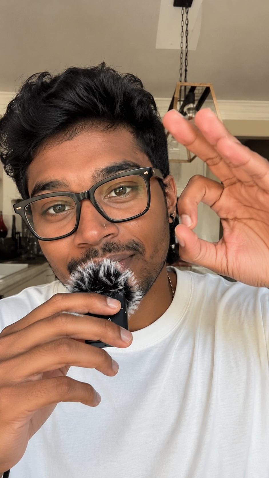 A creator filming a piece to camera with a mic.