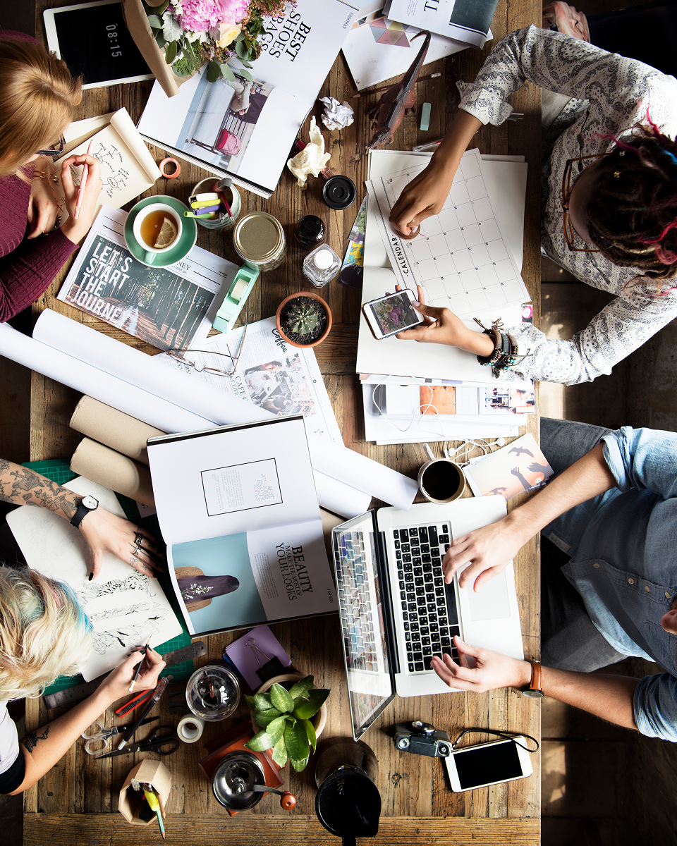 Creative team working together at a shared desk